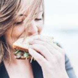 woman eating a sandwich