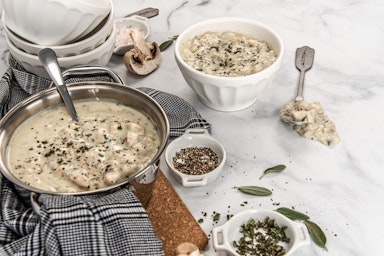 table with pot and bowl of soup