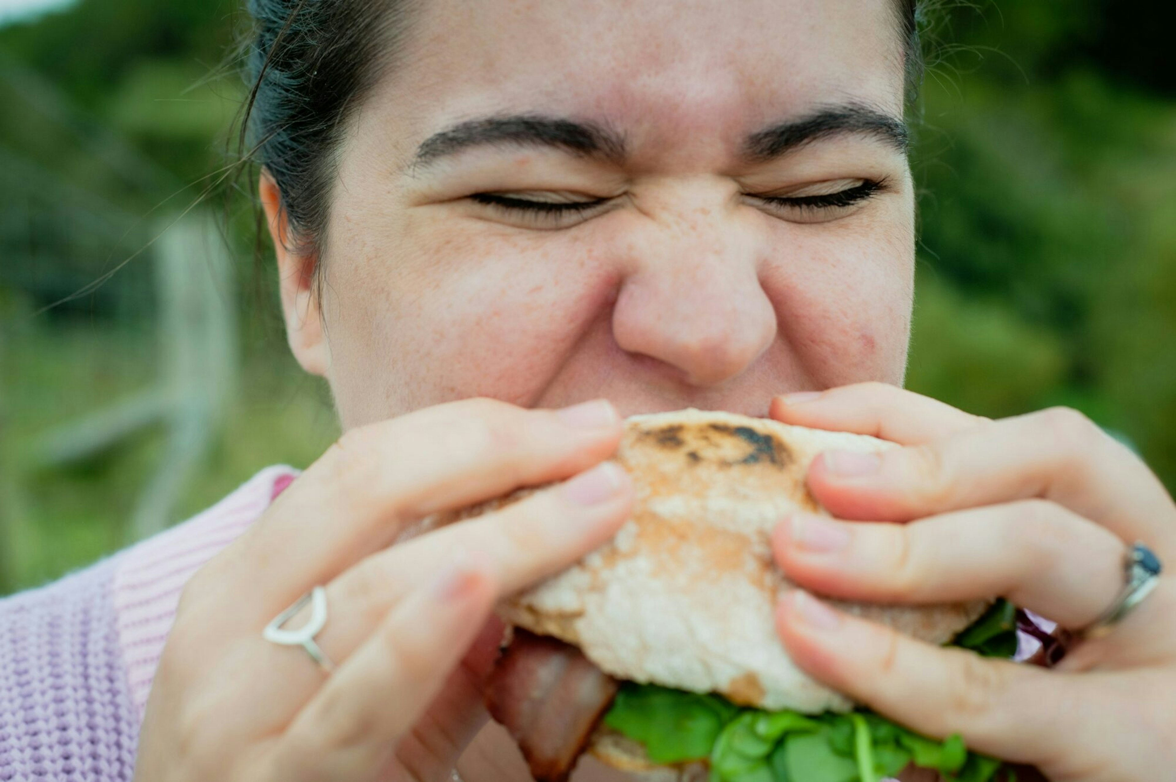 woman eating a sandwich